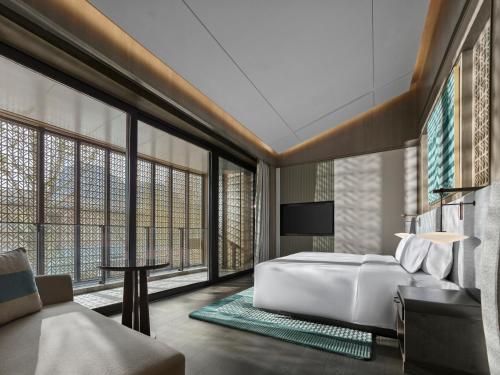 Imagen de la habitación del Hotel Banyan Tree Suzhou Shishan. Foto 17