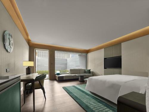 Imagen de la habitación del Hotel Banyan Tree Suzhou Shishan. Foto 18