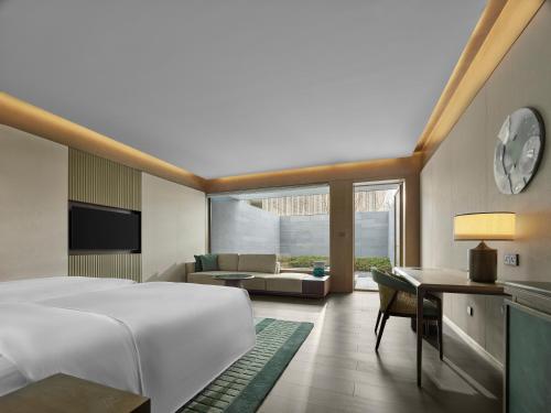 Imagen de la habitación del Hotel Banyan Tree Suzhou Shishan. Foto 19