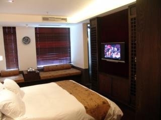 Imagen de la habitación del Hotel Baolong Home. Foto 3