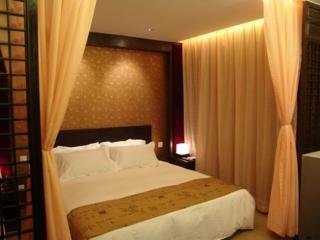 Imagen de la habitación del Hotel Baolong Home. Foto 4