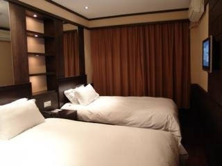 Imagen de la habitación del Hotel Baolong Home. Foto 6
