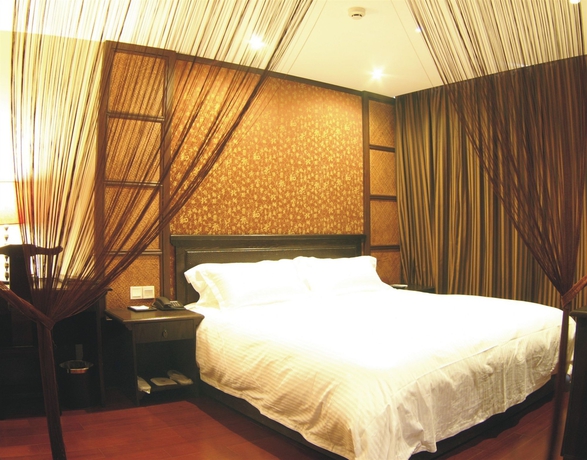 Imagen de la habitación del Hotel Baolong Homelike Mudanjiang Shanghai. Foto 3