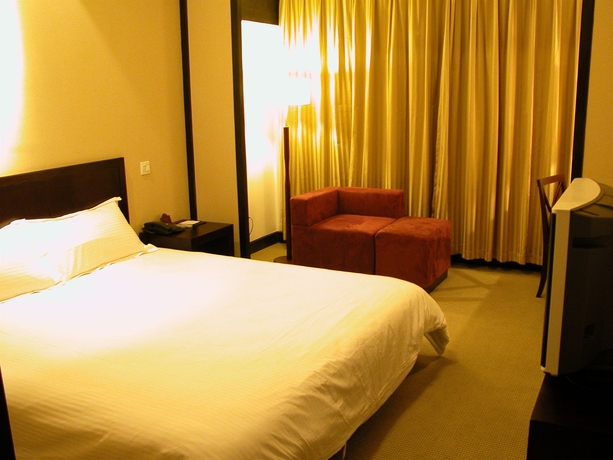 Imagen de la habitación del Hotel Baolong Homelike Wu Song Shanghai. Foto 2