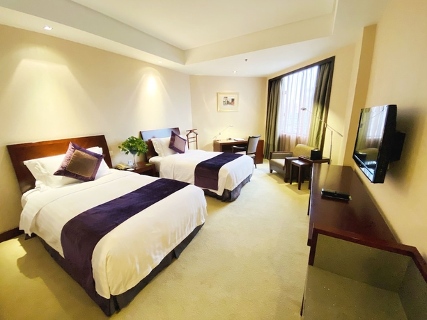 Imagen de la habitación del Hotel Baolong Hotel Shanghai. Foto 14