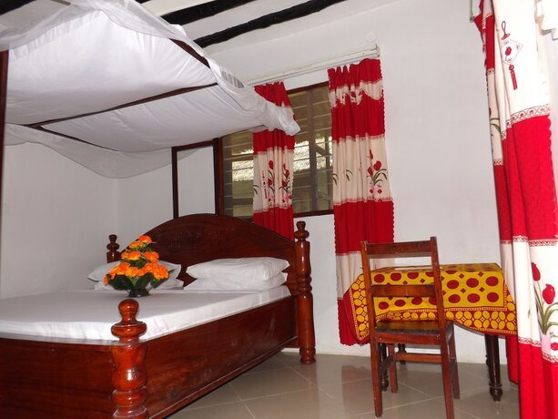 Imagen de la habitación del Hotel Baraka Beach Bungalows. Foto 15