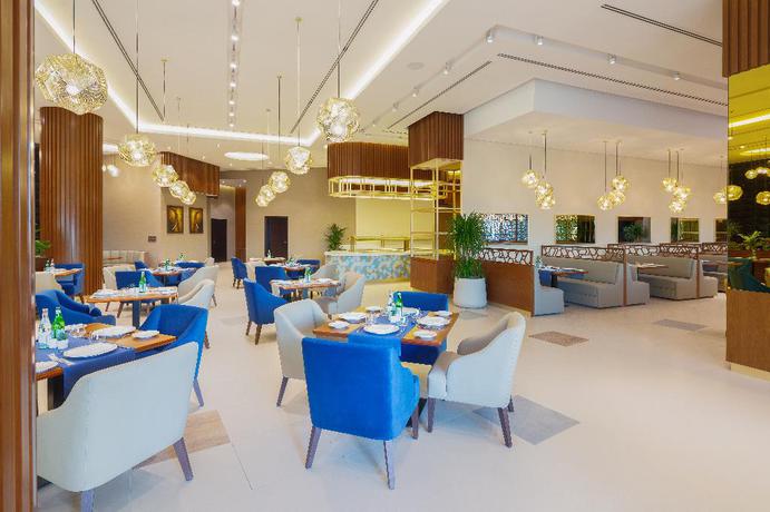 Imagen del bar/restaurante del Hotel Barceló Al Jaddaf. Foto 13