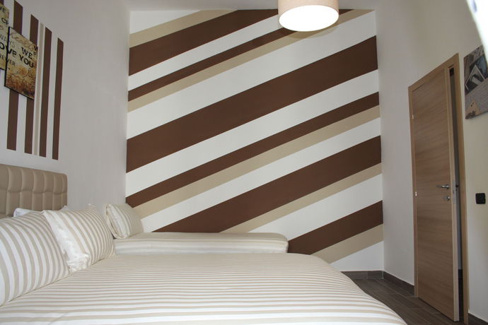 Imagen de la habitación del Hotel Be Italian Bovio Flats. Foto 11