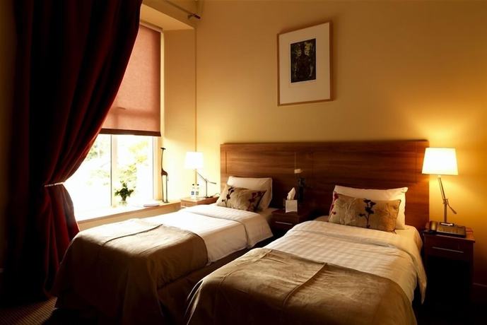 Imagen de la habitación del Hotel Becketts. Foto 17