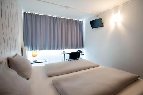 Imagen de la habitación del Hotel BeeVillage Messehotel Hannover Laatzen. Foto 7