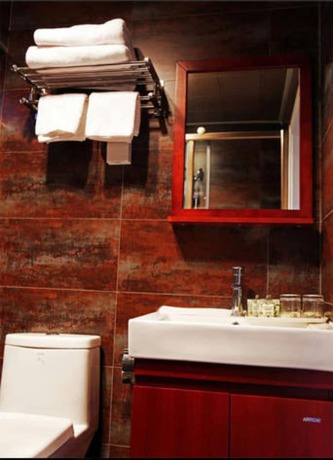 Imagen de la habitación del Hotel Beijing 123 Holiday. Foto 4