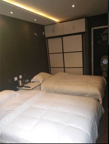 Imagen de la habitación del Hotel Beijing 123 Holiday. Foto 7