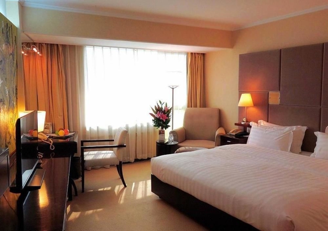 Imagen de la habitación del Hotel Beijing Asia. Foto 7