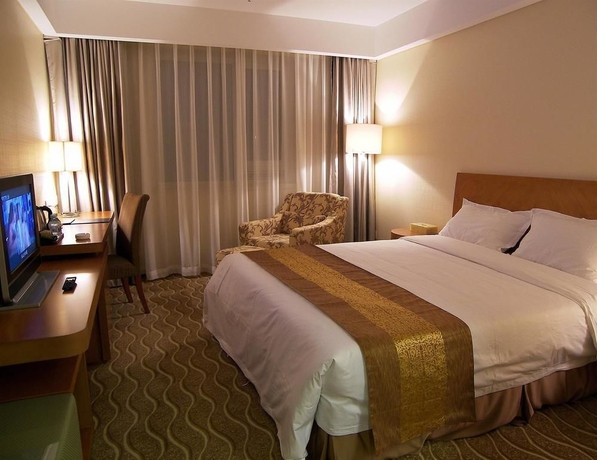 Imagen de la habitación del Hotel Beijing Ausotel Dayu. Foto 2