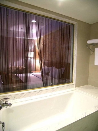 Imagen de la habitación del Hotel Beijing Ausotel Dayu. Foto 8