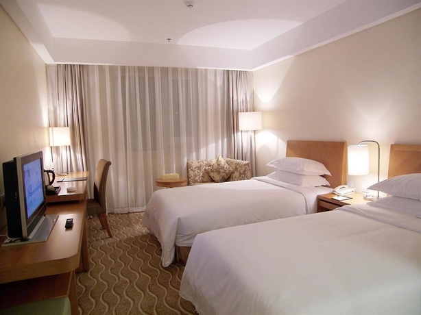 Imagen de la habitación del Hotel Beijing Ausotel Dayu. Foto 9