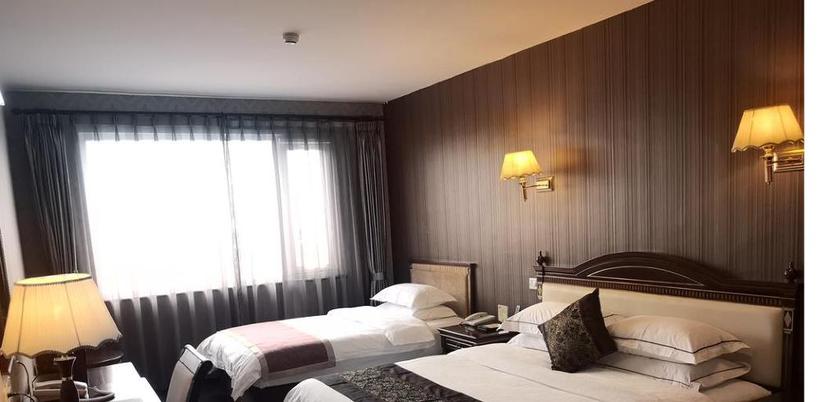 Imagen de la habitación del Hotel Beijing Commercial Business Hotel. Foto 16