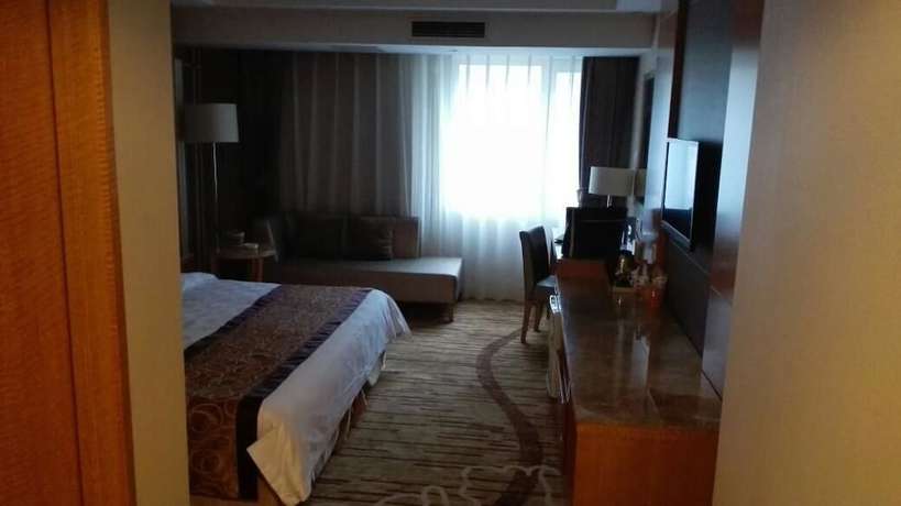 Imagen de la habitación del Hotel Beijing Fuyoujie Hotel. Foto 12