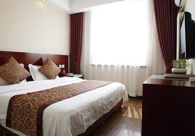 Imagen de la habitación del Hotel Beijing Fuyoujie Hotel. Foto 13