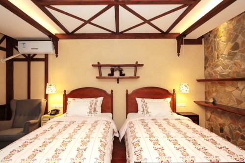 Imagen de la habitación del Hotel Beijing Gubei Water Town Biaoju Inn. Foto 3