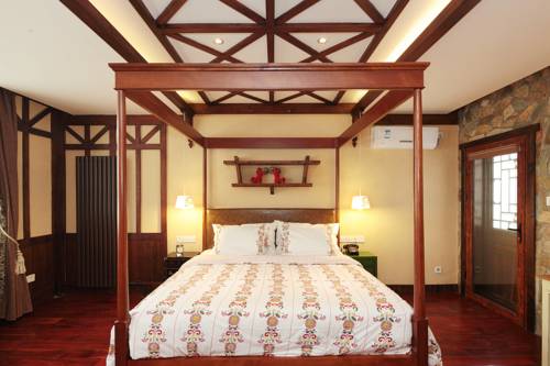 Imagen de la habitación del Hotel Beijing Gubei Water Town Biaoju Inn. Foto 6