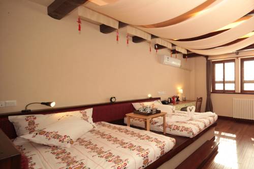 Imagen de la habitación del Hotel Beijing Gubei Water Town Changcheng Inn. Foto 4