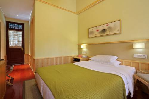 Imagen de la habitación del Hotel Beijing Gubei Water Town Duanjia Inn. Foto 2