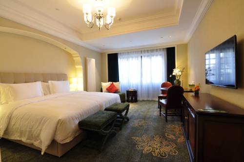 Imagen de la habitación del Hotel Beijing Gubei Water Town William Edgar. Foto 2