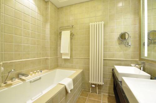 Imagen de la habitación del Hotel Beijing Gubei Water Town William Edgar. Foto 3