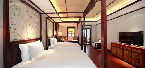 Imagen de la habitación del Hotel Beijing Gubei Water Town Wuzhenhui Boutique. Foto 6