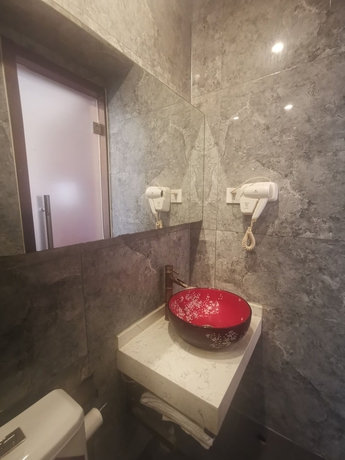 Imagen de la habitación del Hotel Beijing Huiqing Garden Bussiness. Foto 9