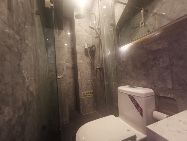 Imagen de la habitación del Hotel Beijing Huiqing Garden Bussiness. Foto 10