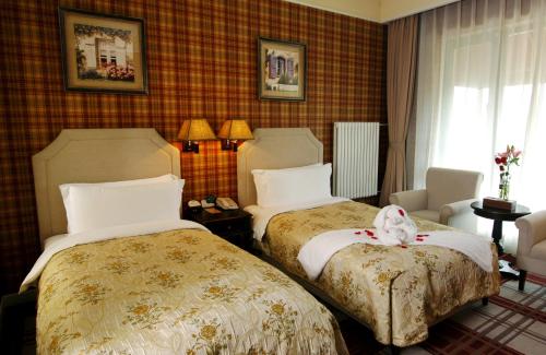 Imagen de la habitación del Hotel Beijing Jinhai Lake Yacht Resort. Foto 6