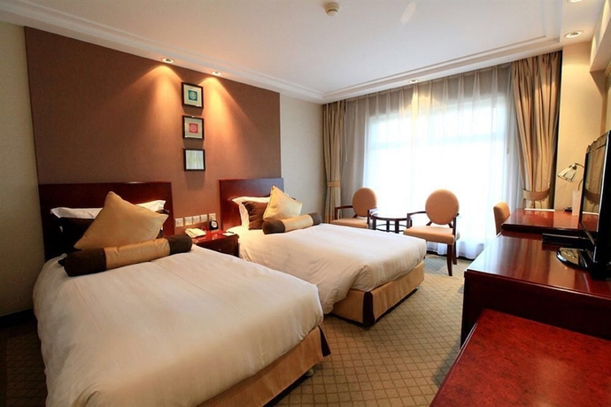 Imagen de la habitación del Hotel Beijing Landmark Hotel. Foto 2
