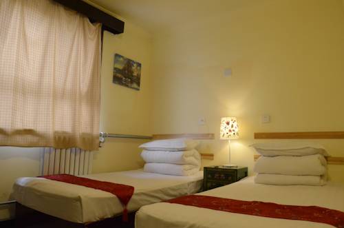 Imagen de la habitación del Hotel Beijing Leo Courtyard. Foto 3