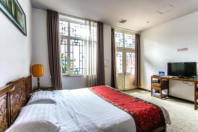 Imagen de la habitación del Hotel Beijing Mingcourtyard. Foto 10