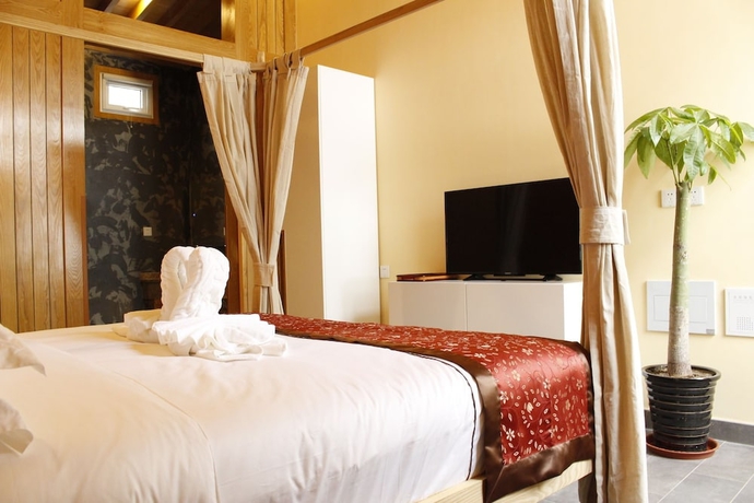 Imagen de la habitación del Hotel Beijing Mingcourtyard. Foto 16