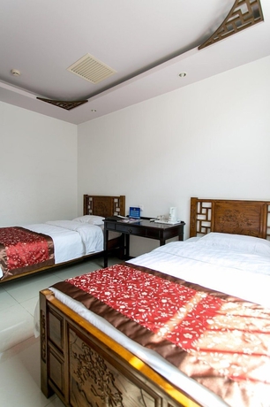 Imagen de la habitación del Hotel Beijing Mingcourtyard. Foto 17