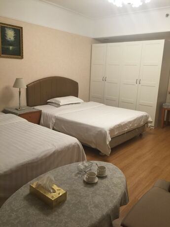 Imagen general del Hotel Beijing New World CBD Apartment. Foto 8