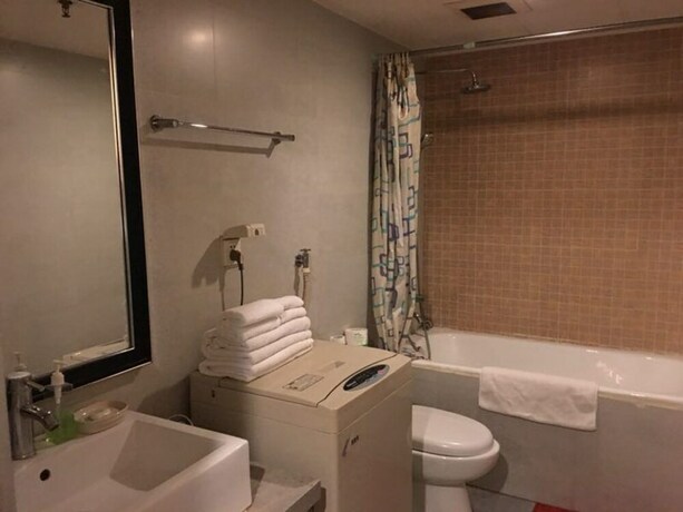 Imagen de la habitación del Hotel Beijing New World CBD Apartment. Foto 14