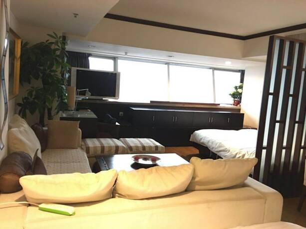 Imagen de la habitación del Hotel Beijing New World CBD Apartment. Foto 15