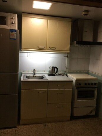 Imagen de la habitación del Hotel Beijing New World CBD Apartment. Foto 18