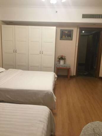 Imagen de la habitación del Hotel Beijing New World CBD Apartment. Foto 21