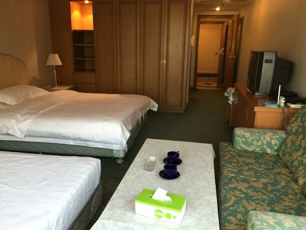 Imagen de la habitación del Hotel Beijing New World CBD Apartment. Foto 23