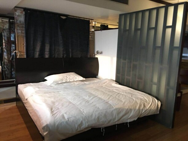 Imagen de la habitación del Hotel Beijing New World CBD Apartment. Foto 24