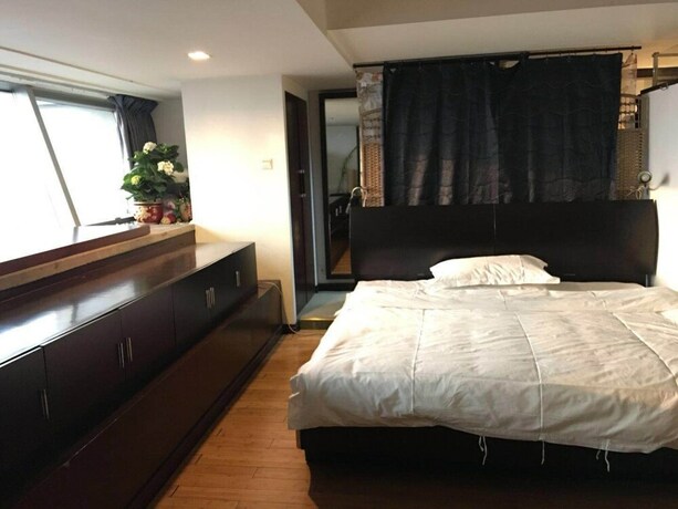 Imagen de la habitación del Hotel Beijing New World CBD Apartment. Foto 25