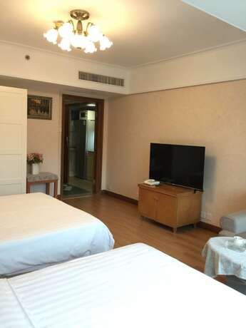 Imagen de la habitación del Hotel Beijing New World CBD Apartment. Foto 27