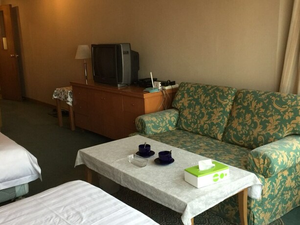 Imagen de la habitación del Hotel Beijing New World CBD Apartment. Foto 28