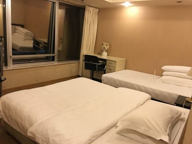 Imagen de la habitación del Hotel Beijing New World CBD Apartment. Foto 29