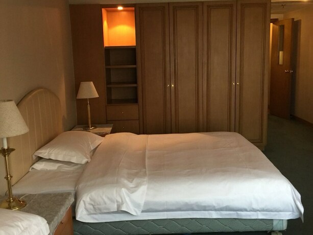 Imagen de la habitación del Hotel Beijing New World CBD Apartment. Foto 30